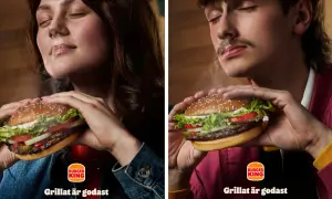 Två personer njuter av en saftig hamburgare från Burger King. Röken stiger från burgaren och skapar en härlig atmosfär.