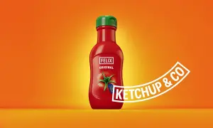 A red Felix Original ketchup bottle with a green cap on an orange background.