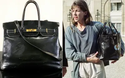 En ikonisk svart Birkin-väska, en av de mest exklusiva i sitt slag, bärs av Jane Birkin.