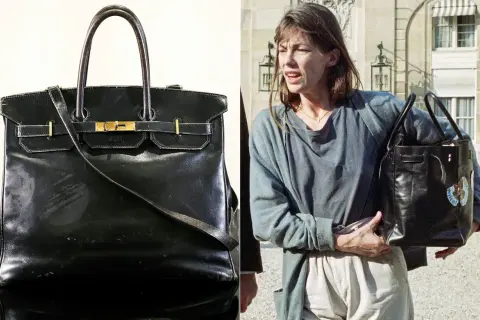 En ikonisk svart Birkin-väska, en av de mest exklusiva i sitt slag, bärs av Jane Birkin.