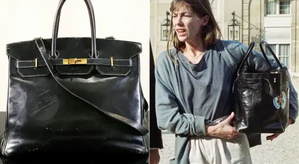En ikonisk svart Birkin-väska, en av de mest exklusiva i sitt slag, bärs av Jane Birkin.