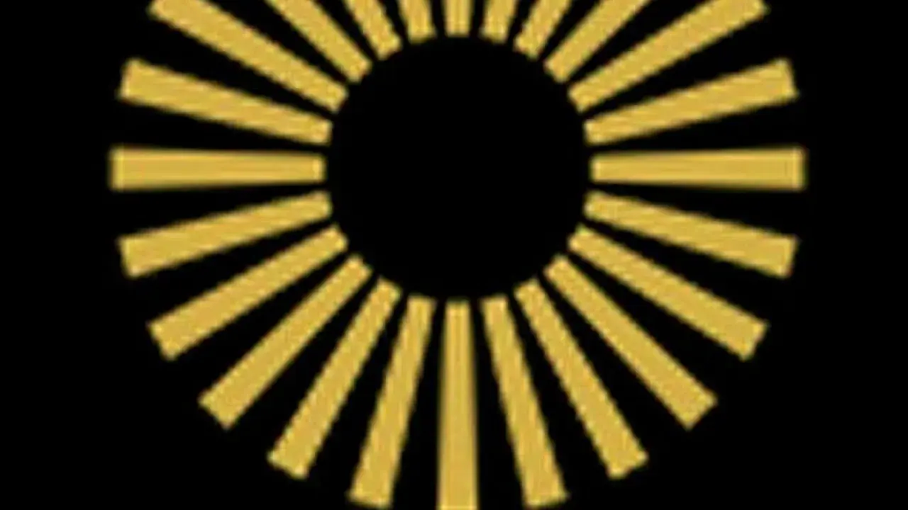 Ett gyllene hjul med strålar mot en svart bakgrund, som en sol eller en symbol för framgång.