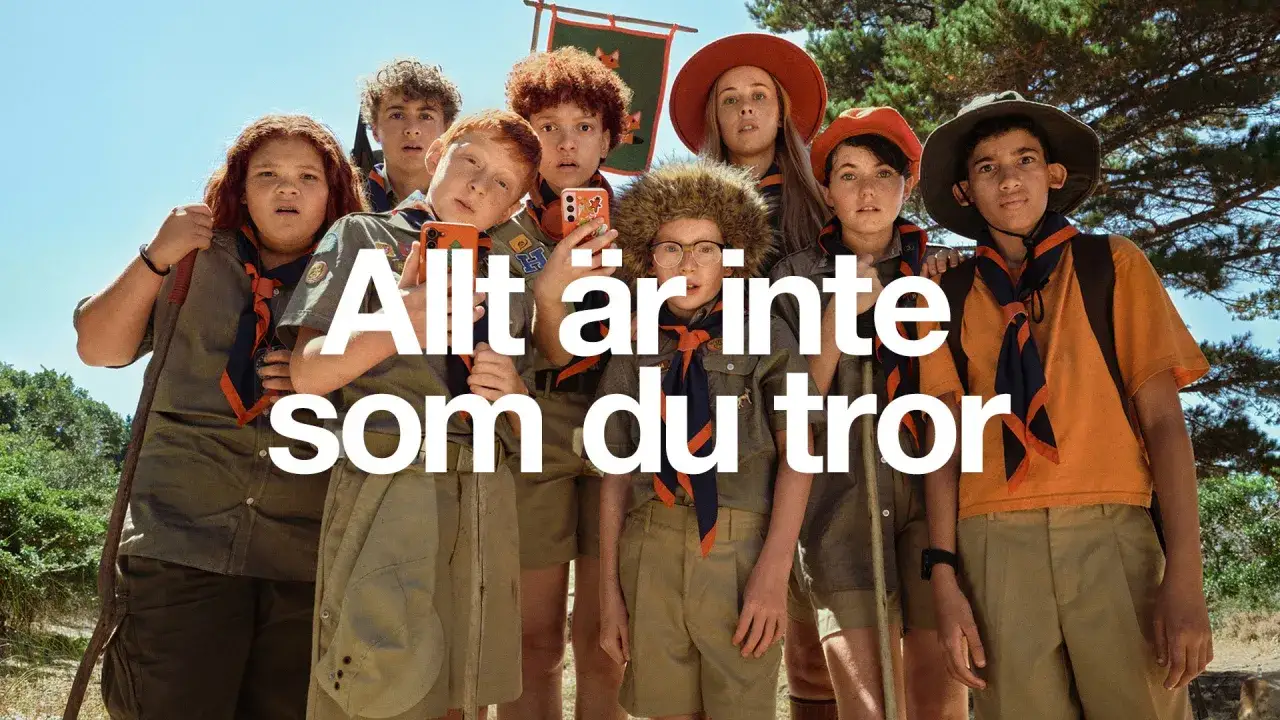 En grupp scouter poserar för en bild. Texten